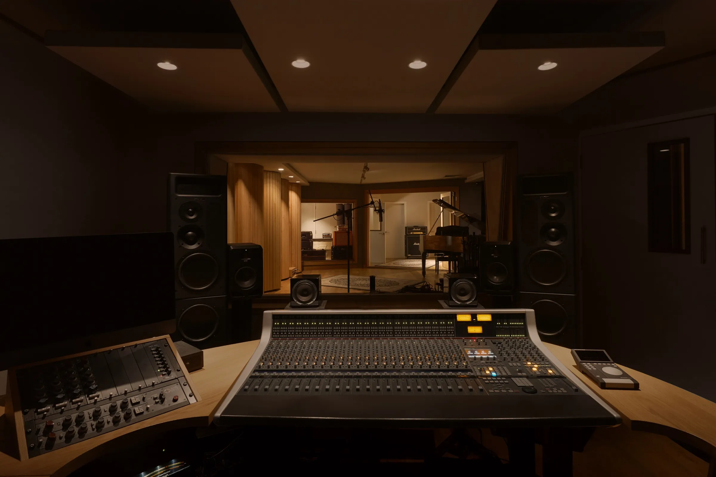 The A Sharp control room - SSL AWS 948 console and main monitors, looking through to the lit live room